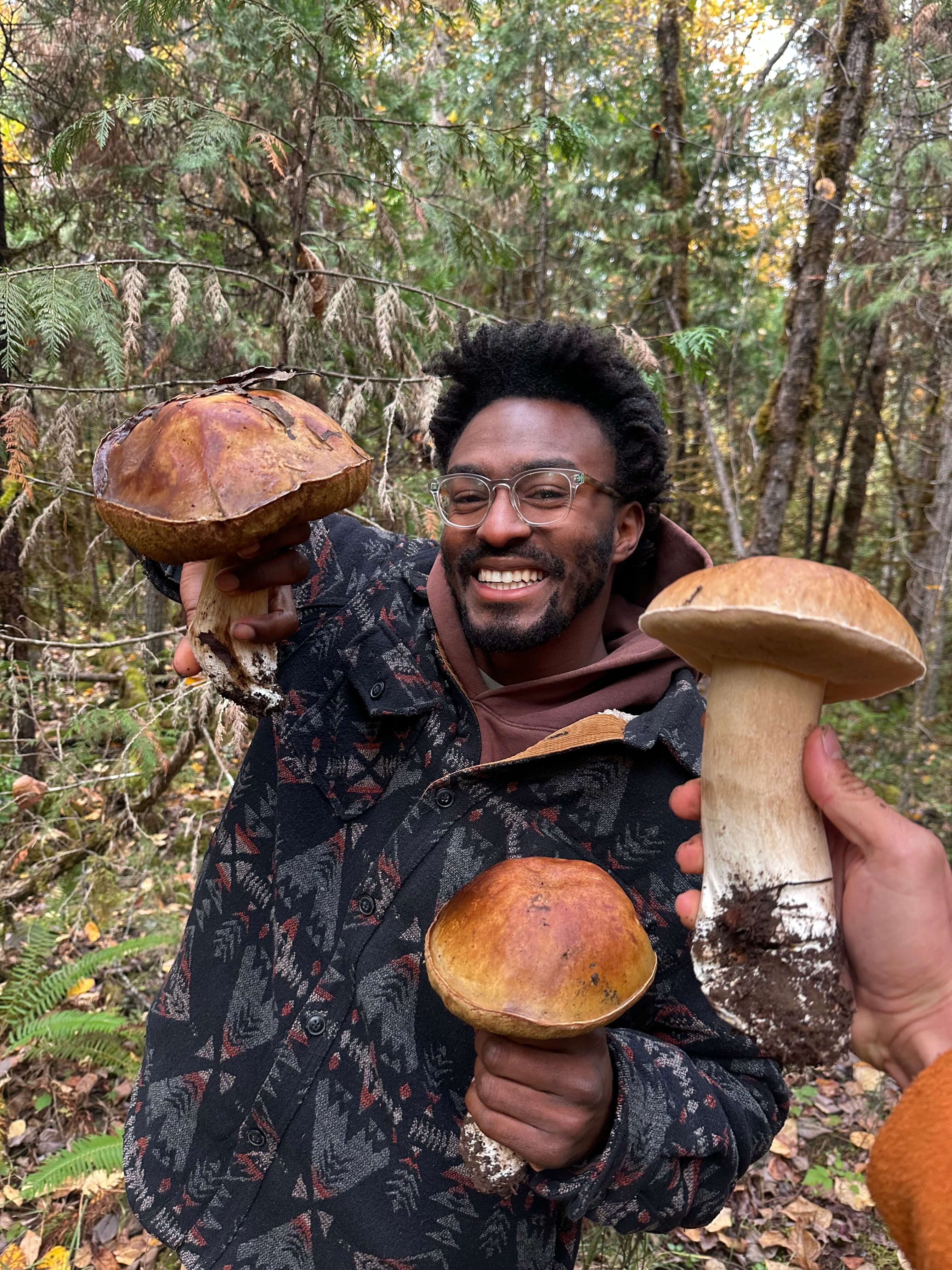 Frank holding boletes and Jake has one too